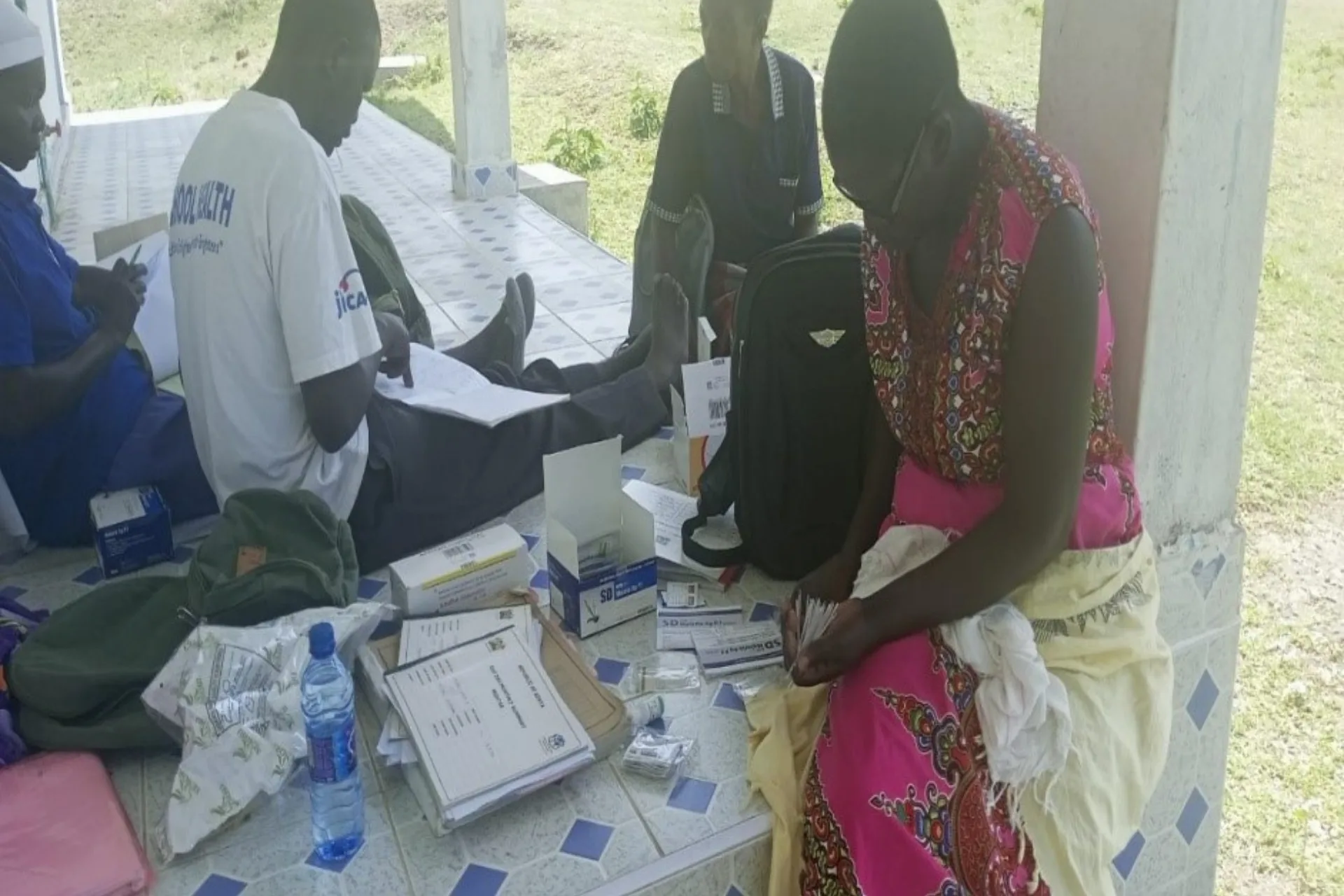 Community health volunteer conducting malaria rapid diagnostic test in Homa Bay County