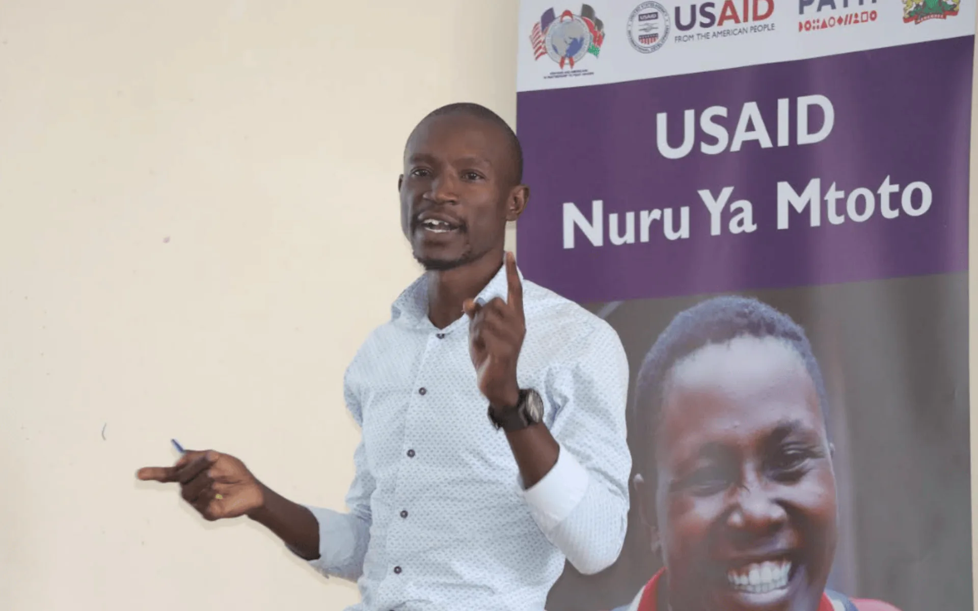 USAID Nuru Ya Mtoto project staff with vulnerable children